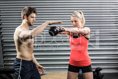 Couple exercising with dumbbells