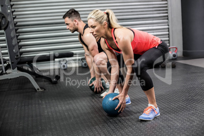 Couple doing ball exercise