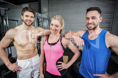 Smiling fit people posing