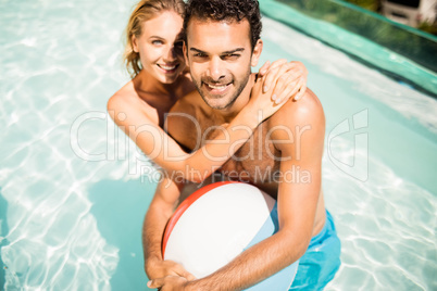 Happy couple with beach ball