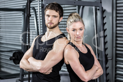 Fit couple with arm crossed