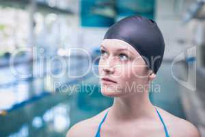 Pretty woman wearing swim cap