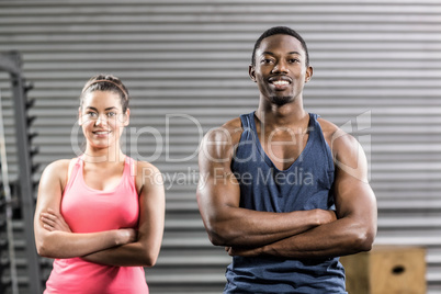 Fit couple with arm crossed