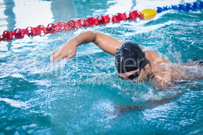 Handsome man swimming