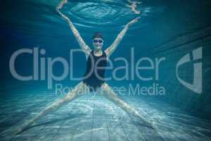 Pretty woman stretching underwater