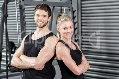 Fit couple with arm crossed