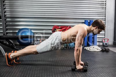 Man doing push up with dumbells