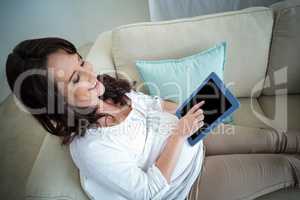 Pregnant woman resting on couch