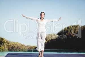 Calm brunette doing yoga