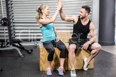 Fit couple doing high five