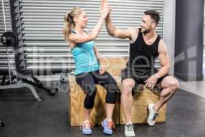 Fit couple doing high five