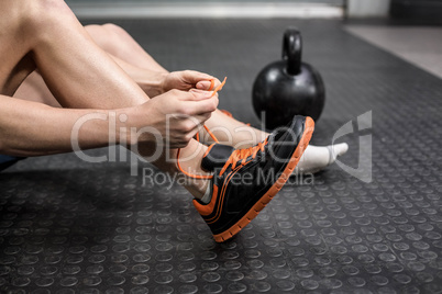 Man tying his shoelaces