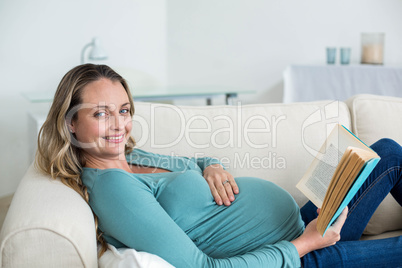 Pregnant woman reading a book