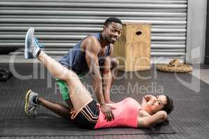 Fit couple doing exercises