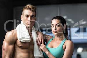 Fit couple posing in front of the camera