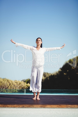 Calm brunette doing yoga