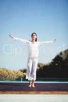 Calm brunette doing yoga