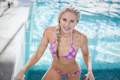 Attractive woman getting out of the water