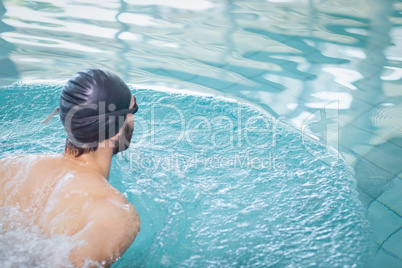 Fit man swimming