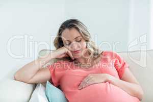 Pregnant woman touching her belly