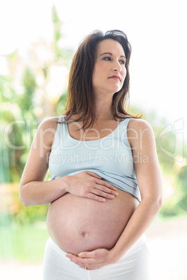 Pregnant woman touching her belly