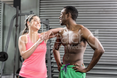 Fit couple with hands on hips