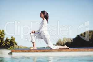 Calm brunette doing yoga