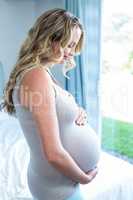 Pregnant woman touching her belly