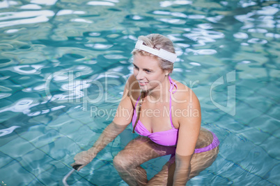 Fit woman doing underwater bike