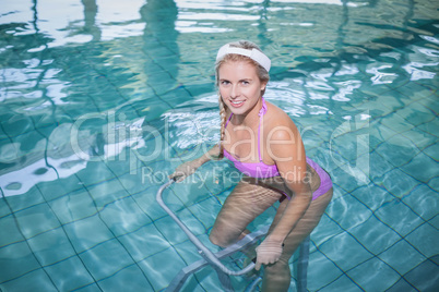 Fit woman doing underwater bike