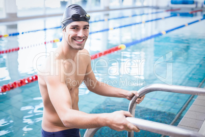 Handsome man getting out of the water