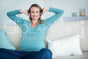 Pregnant woman listening to music