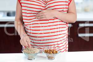 Pregnant woman eating cereals