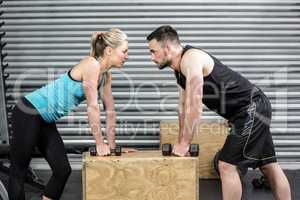 Couple lifting dumbbells together