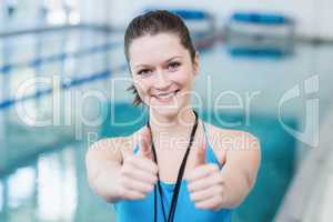 Pretty trainer with thumbs up