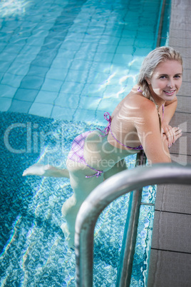 Attractive woman resting on the edge