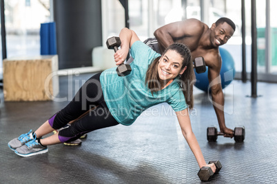 Athletic man and woman working out