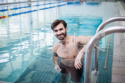 Fit man standing in the water