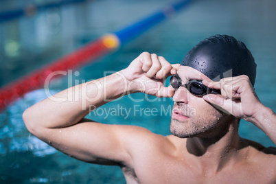 Upset man wearing swimming goggles