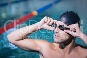 Upset man wearing swimming goggles