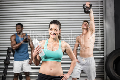 Fit people lifting dumbbells