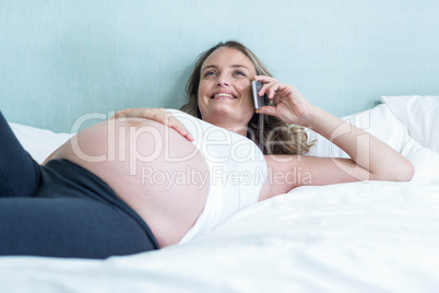 Pregnant woman making a phone call