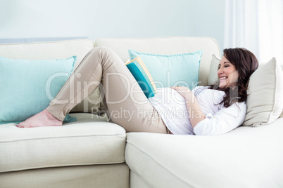 Pregnant woman reading a book