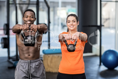 Athletic man and woman working out