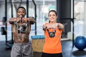 Athletic man and woman working out