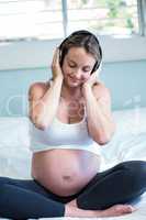 Pregnant woman listening to music