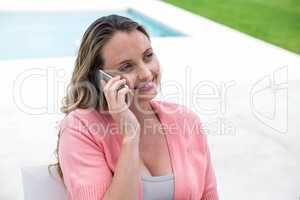 Pregnant woman making a phone call
