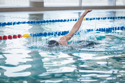 Fit man swimming