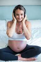 Pregnant woman listening to music