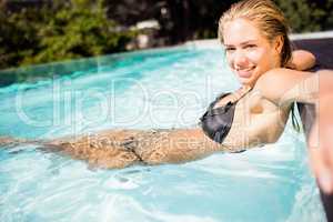 Blonde relaxing in the pool